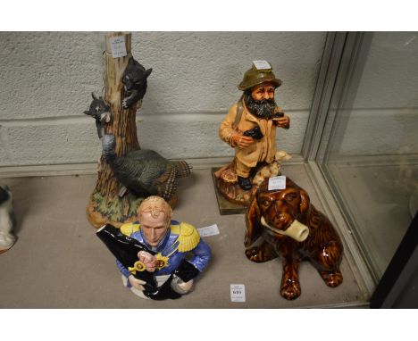 A novelty teapot and other items to include novelty decanters.
