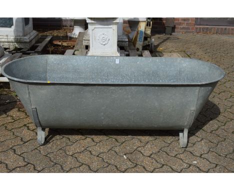 A large galvanised bath/planter.