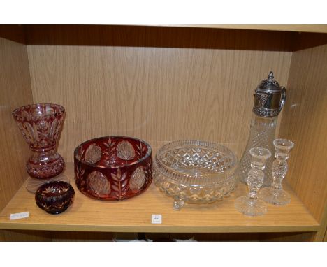 Cut glass bowls, a vase, a pair of candlestick and a claret jug.