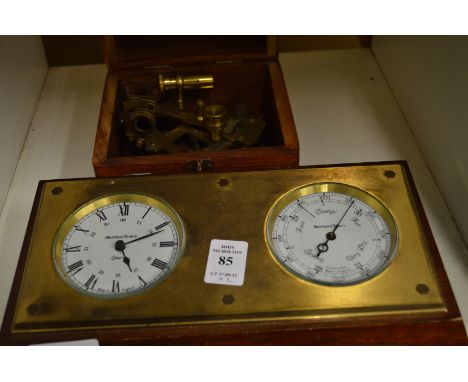 A desk clock/barometer and a reproduction sextant in a box.