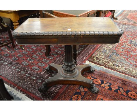 A 19th century rosewood fold over card table.