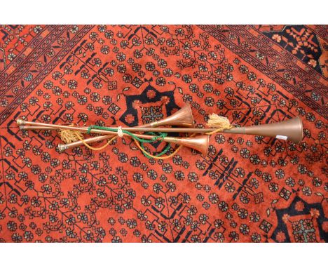 Three copper hunting horns.
