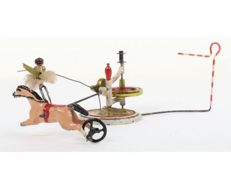 Early Britains The Equestrienne flywheel operated toy, circa 1900, when operated the horse rotates round the base with the la