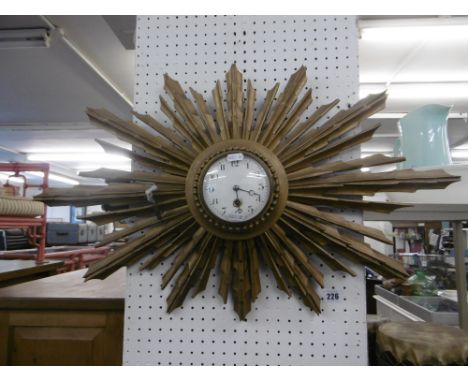 A GILT SUNBURST CLOCK