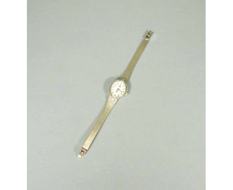   Corona, Damenarmbanduhr  Corona, Damenarmbanduhr   14 K Weißgold. Damenarmbanduhr in Weißgold, besetzt mit 2 Diamanten. Am 