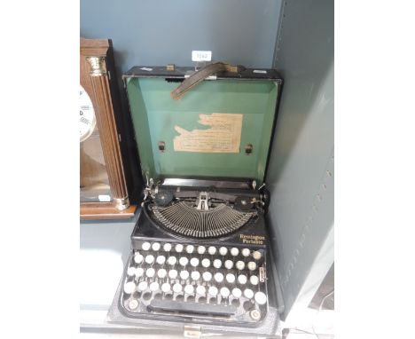 A Remington Portable typewriter with case no EC29610 dated 1932