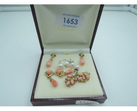 Three pairs of modern coral style stud earrings of various styles in gold plated mounts and a pair of double pearl earrings o