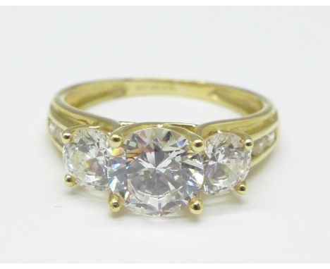 A 14ct gold three stone diamonique cz ring, 4g, R 