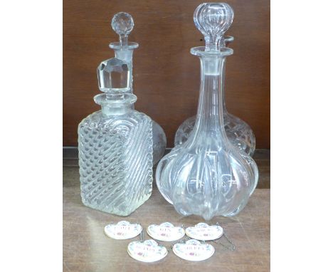 Four decanters and five Coalport ceramic spirit labels 