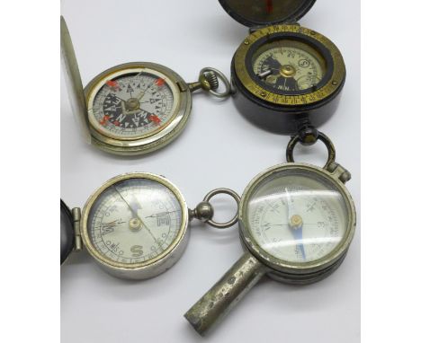 A compass marked J.H. Steward, London, also marked Cavalry School Compass and three other compasses, (3 other a/f) 