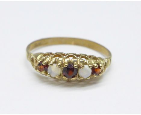 A 9ct gold, opal and garnet ring, 1.1g, N 