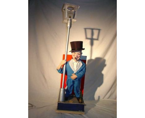 The Grand FattiniAttention getter automaton Controller with a top hat and character drunk near a lamppost. Original JAF atten