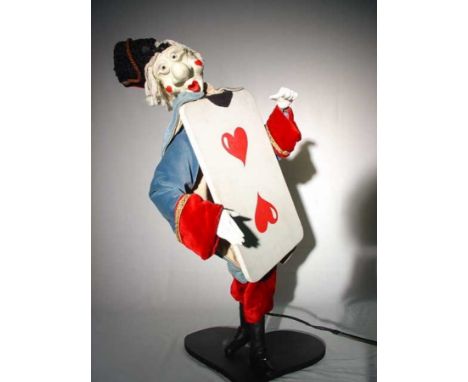 The Heart 2 Figure standing and grimacing holding a playing card . by famous french artist Bardot. Electrified window display
