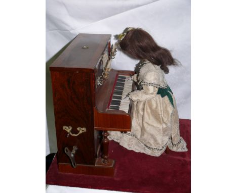 Girl at the Piano by LAMBERT or RENOU Creation by LAMBERT or RENOU. Small mechanical automaton depicting a young woman playin