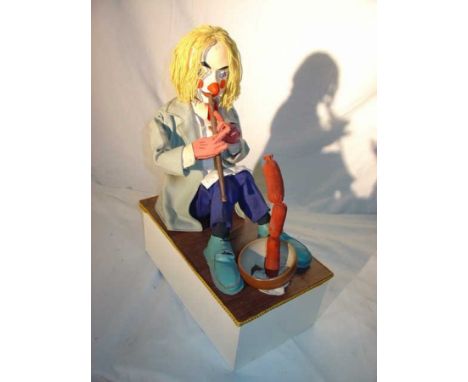 Clown sausages charmer Clown charming sausages. Electrified window display automaton with 2 movements in good working conditi