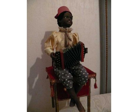 small bandoneon player by Marcu Automate "Bandoneon player" by Michel MARCU. Mechanical automaton, a child playing the bandon