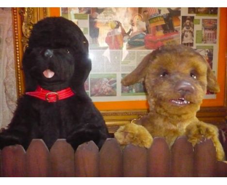 Two pooches Two pooches behind the barrier. Electrified window display automaton with 2 movements in good working condition (