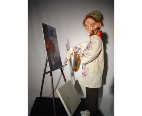The Painter Wooden automaton, biscuit and tissue, holding a palette ,ready to finish the painting. Electrified window display