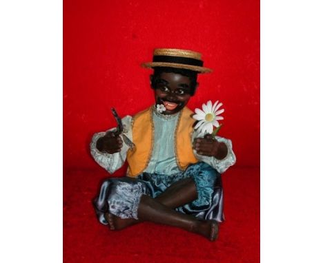 The Islands child by JAF Nice automaton by JAF. Cross -Legged wearing a straw hat and holding a daisy in his left hand. Elect