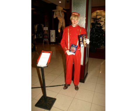 The great Bellboy life-size automaton.. Important wooden automaton, biscuit, plastic in bellboy costume. Electrified window d