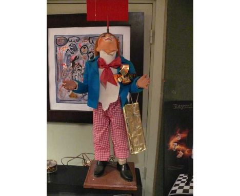Clown Sign Juggler by JAF Important window display of a clown holding a mobile sign balanced on his nose. Created by JAF. Ele