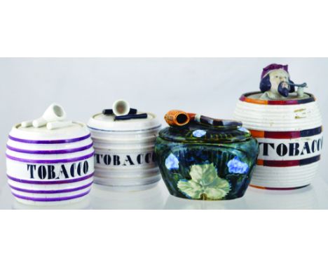 GROUP OF TOBACCO JARS. Continental (French) jar fools head with pipe to lid barrel shape jar TOBACCO in black lettering. Gree