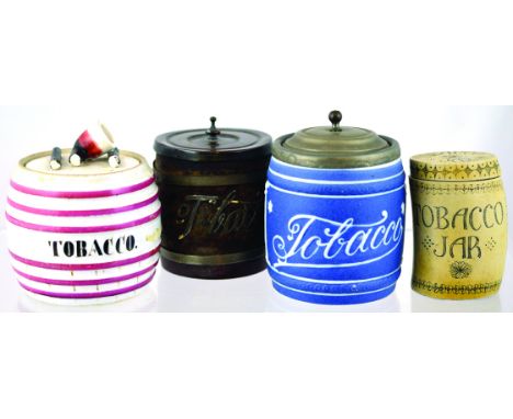 GROUP OF TOBACCO JARS. Continental jar cover with broken pipe finial TOBACCO in black lettering white glaze with pink bands, 