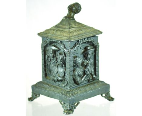 DUTCH LEAD TOBACCO JAR. 8.25ins tall to top of cover with Negro head finial, square shape with Dutch figures in relief to eac