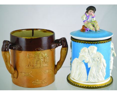 SALT GLAZE TYG. 5.5ins tall, brown top lower tan salt glaze, 3 greyhound handles with raised hunting motifs all around. Doult