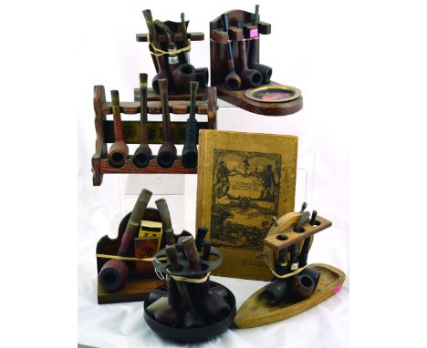 GROUP OF 6 PIPE RACKS. With pipes, plus book: Tobacco Its Culture and Manufacture with compliments of W.D. & H.O. Wills Brist