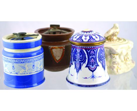 GROUP OF TOBACCO JARS. Blue & white glazed cylindrical jar with winged lions? frieze all around with brass clamp lid, contine
