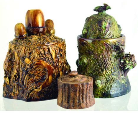 TOBACCO JARS GROUP. Heavy brown glazed tree trunk style stoneware jar with acorns to lid, large one to take matches. Plus hea