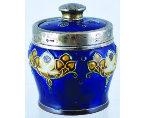 DOULTON TOBACCO JAR. 5.5ins tall to top of lid with silver finial. Art Nouveaux style raised decoration on dark blue ground w