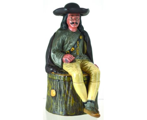LARGE FIGURAL TOBACCO JAR. 10.5ins tall, continental terracotta jar formed as a seated Mexican soldier? on a tree trunk in br