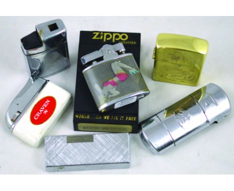 CIGARETTE LIGHTERS. Includes cased brass Zippo lighter, one with pin up girls, Craven A lighter & Tommy pipe lighter etc. (7)