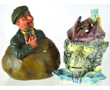 PAIR OF TOBACCO JARS. Monkeys head jar & hat cover with holes to take pipes? brown, grey, blue & white glaze. Plus continenta