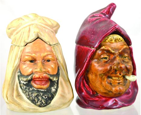 PAIR OF TOBACCO JARS. Arabs head jar 6.25ins tall to top of lid, part of headress matt white, black & flesh tones. Plus hoode