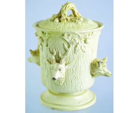 TOBACCO JAR. 6.5ins tall to top of lid with acorns. Off white glaze, tree trunk style with protruding stags & foxes heads all