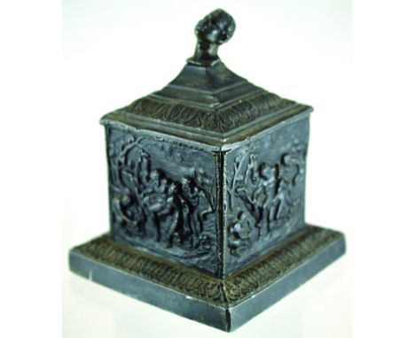DUTCH LEAD TOBACCO JAR. 7.25ins tall to top of lid with mans head finial. Square shape with pressed panels of naked figures 1