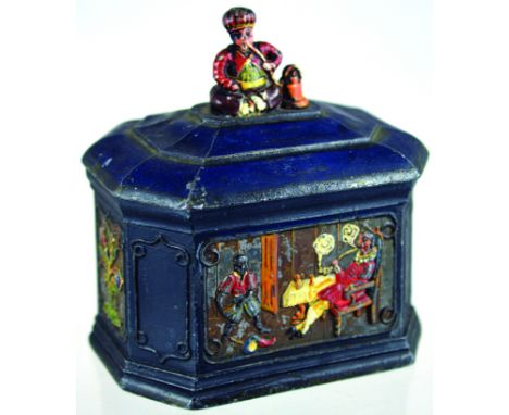 CAST LEAD TOBACCO JAR. 5.75ins tall to top of cover, cold painted in low relief panels showing Sir Walter Raleigh, doused by 