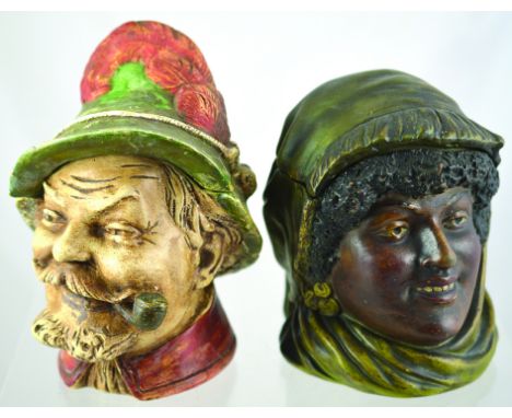PAIR TOBACCO JARS. Continental Swiss/ Austrian jar, hat lid with red feather, jovial gent smoking pipe matt glazed. Plus blac
