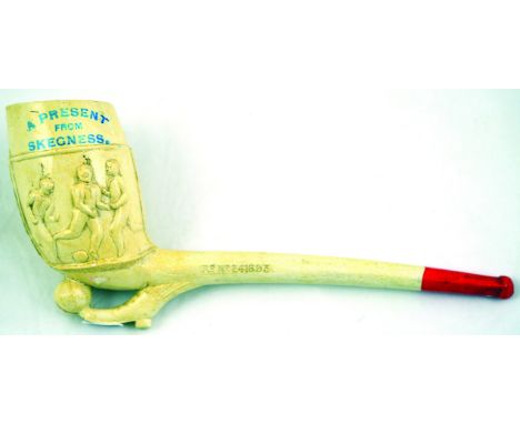 SKEGNESS LARGE CLAY PIPE. 8.5ins long, footballers pipe, boot kicking ball to base of pipe bowl footballers to bowl A PRESENT