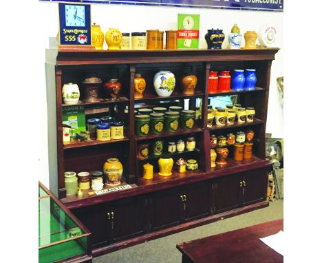 LARGE MAHOGANY SHOP DISPLAY UNIT. 6ft 10ins tall, 9ft 3ins long, 18ins deep at base corniche to top. Wooden & glass shelves b