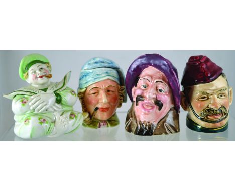 GROUP OF TOBACCO JARS. Continental tobacco jar, sailor sat crossed legged smoking pipe, pale green floral design TOBACCO twic