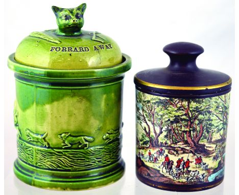 PAIR OF HUNTINGWARE TOBACCO JARS. Green glazed example 6.75ins tall to top of fox's head finial to lid impressed FORRARD AWAY
