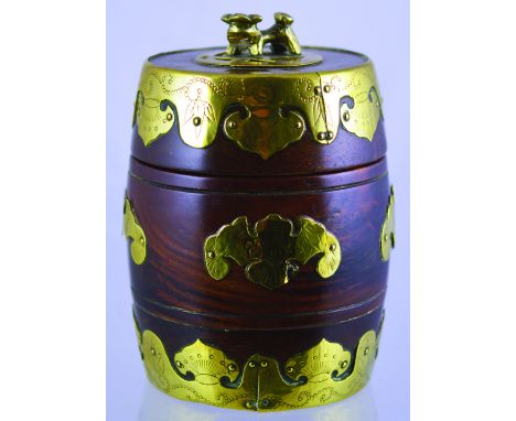 CHINESE STYLE TOBACCO JAR. 6.75ins tall to top of lid with dog finial, mahogany with brass decoration. Good. (8/10) NR