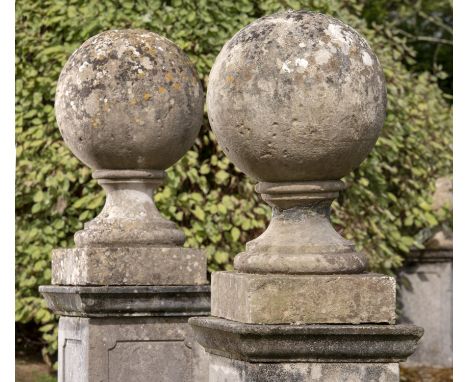 Architectural: A pair of carved stone gate pier balls, 19th century, 76cm high by 46cm diameter