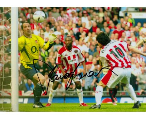 David Seaman signed 12x8 inch colour photo pictured in action for Arsenal. Good condition. All autographs come with a Certifi