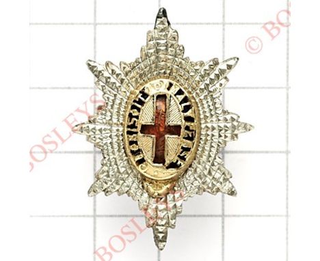 Coldstream Guards Officer’s service dress cap star.Silver, gilt and enamels impressed “STERLING”