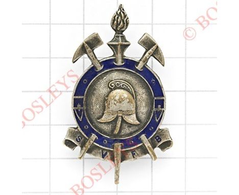 SVFB Victorian fire brigade mufti / lapel badge.Silvered example with fire helmet and crossed axes. Blue enamel strap.